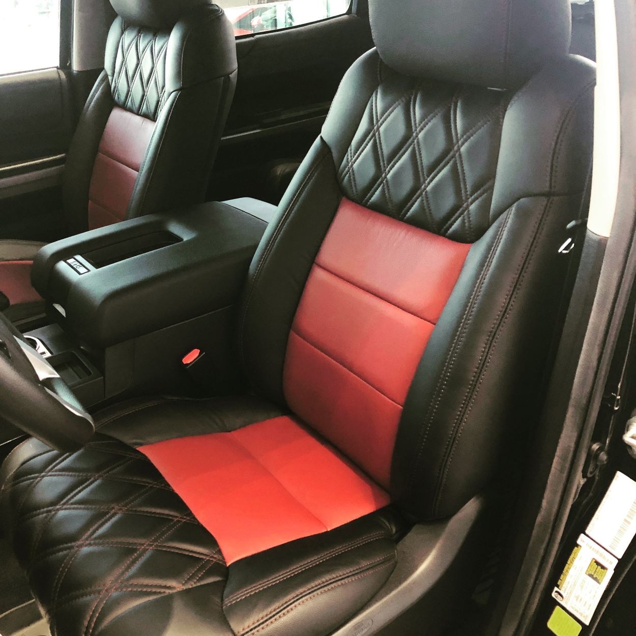 Light gray leather with delicate red piping